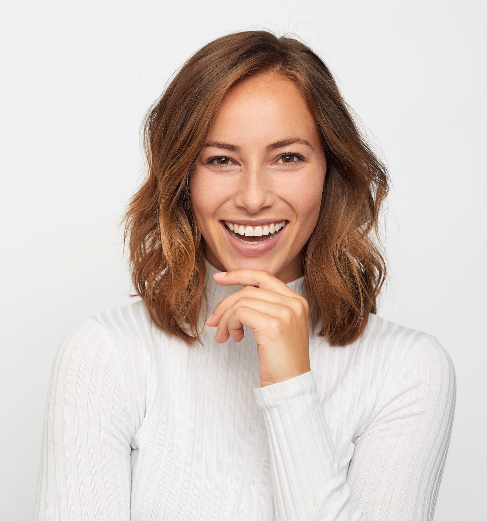 Paciente com sorriso radiante na Clínica OdontoPlan