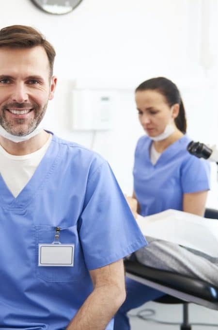 portrait-of-smiling-male-dentist-in-dentist-s-clinic-pfme9zh2jn7oqbsn3wjejmuvk0mpgp4mrabmiwnkeo.jpg